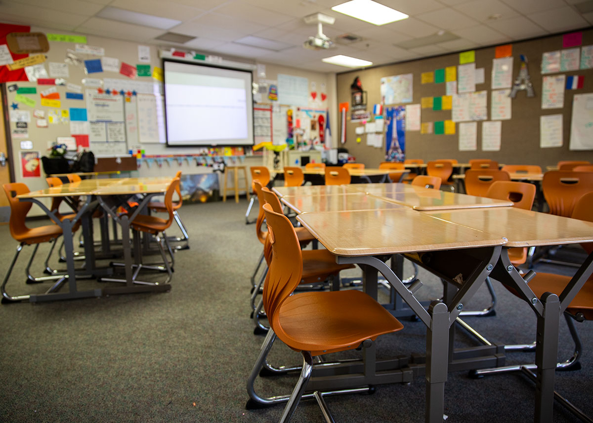 class room filled with orange chairs